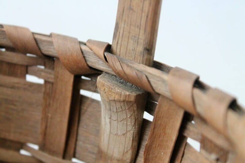 Notched handle on antique basket