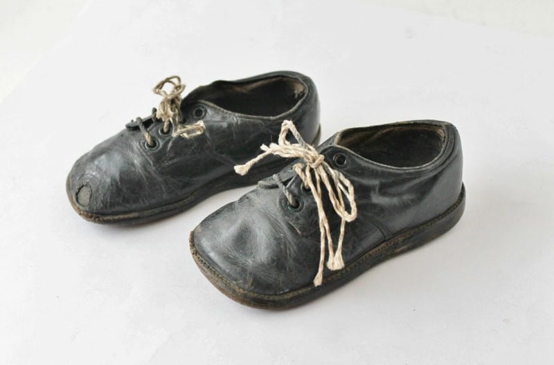 Pair of black leather baby shoes
