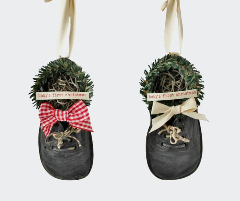 Pair of vintage black baby shoes decorated bor Christmas