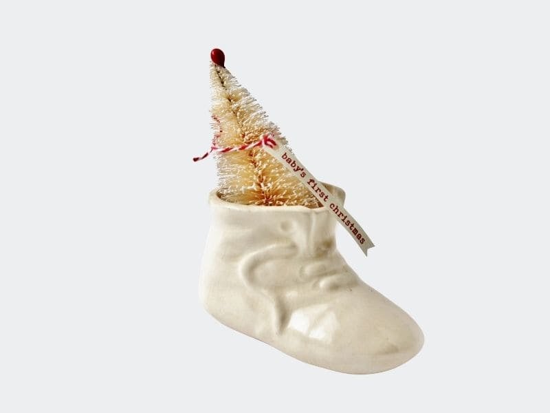 vintage ceramic baby shoe decorated for baby's first Christmas
