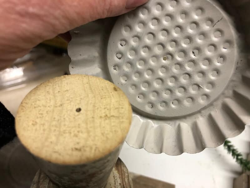 Attaching the tart tin to the top of the spindle to create a "holder" for the candle