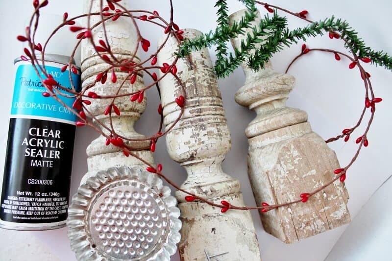 Materials: acrylic sealer, tart tins, spindles, pine garland, berry garland