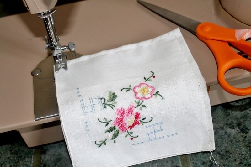 Sewing an antique hankie to create a pouch