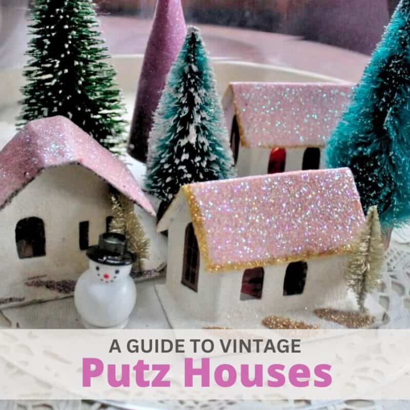 three vintage pink putz houses with bottle brush trees