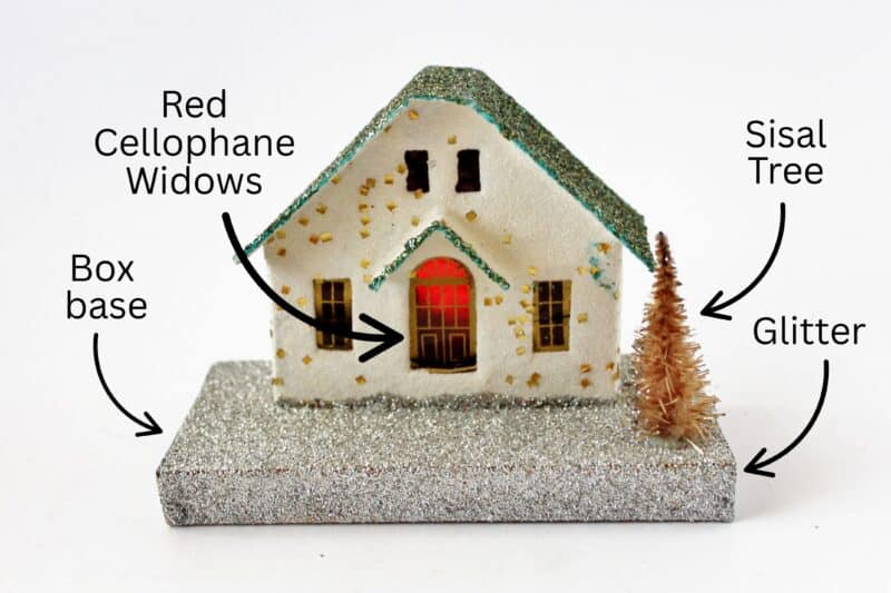 Vintage putz house diagram showing cellophane windows, glitter, box base, & sisal tree