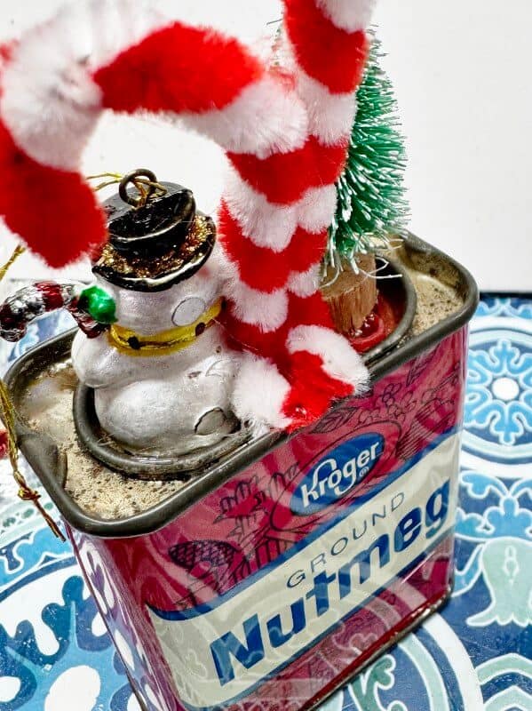 back view of diorama on vintage spice tin