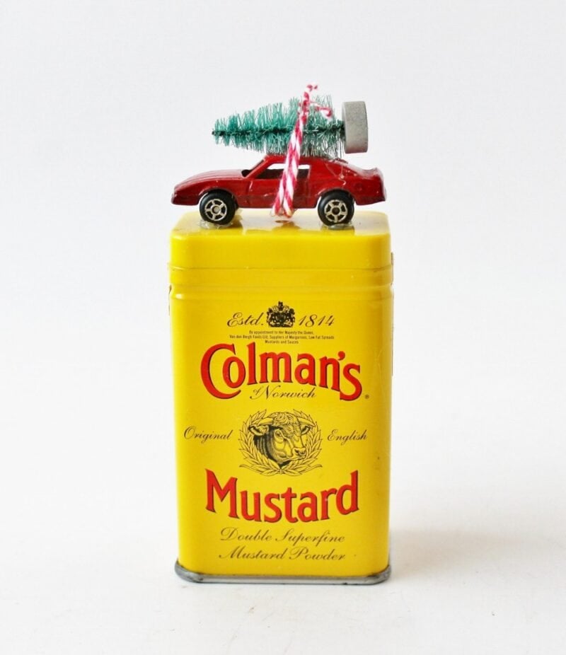 vintage colman's mustard tin with matchbox car christmas decoration