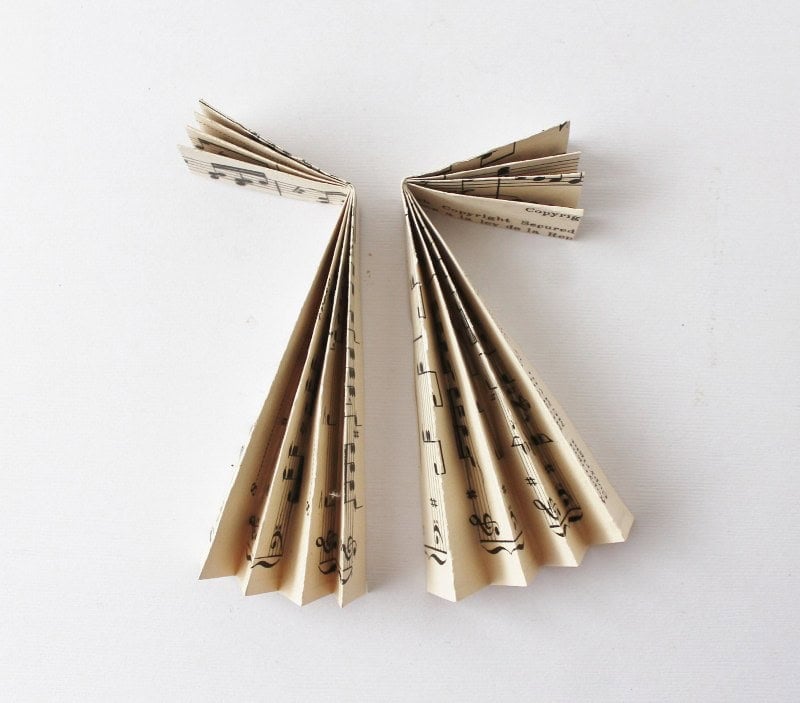Separate halves of vintage music paper angel