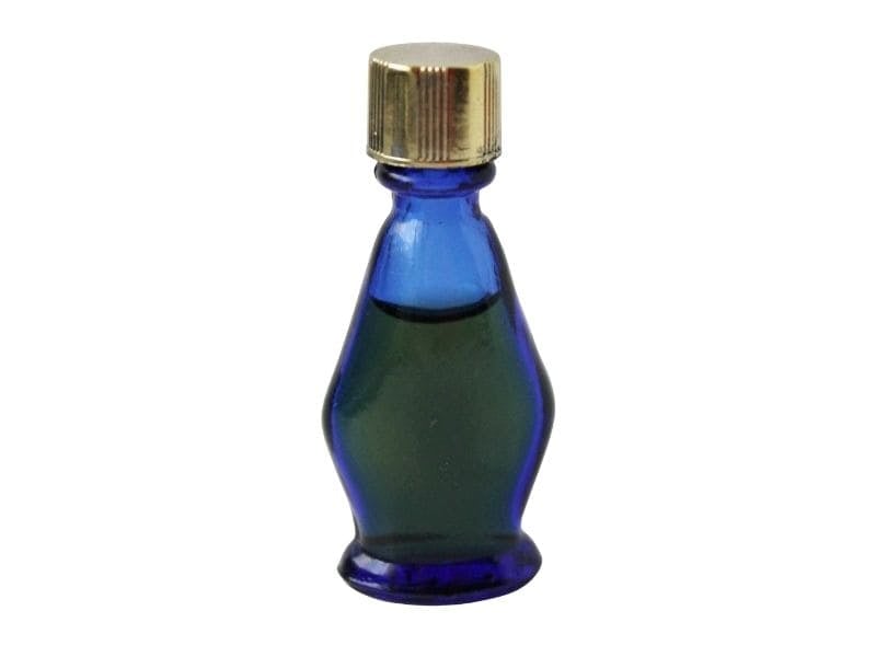 tiny cobalt blue bottle of evening in paris perfume