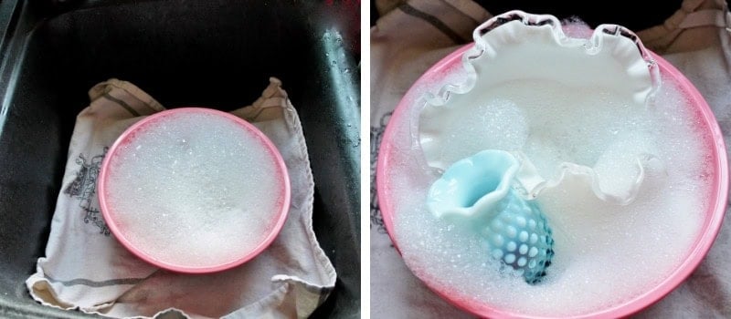 pink bowl with suds & bowl with glassware soaking