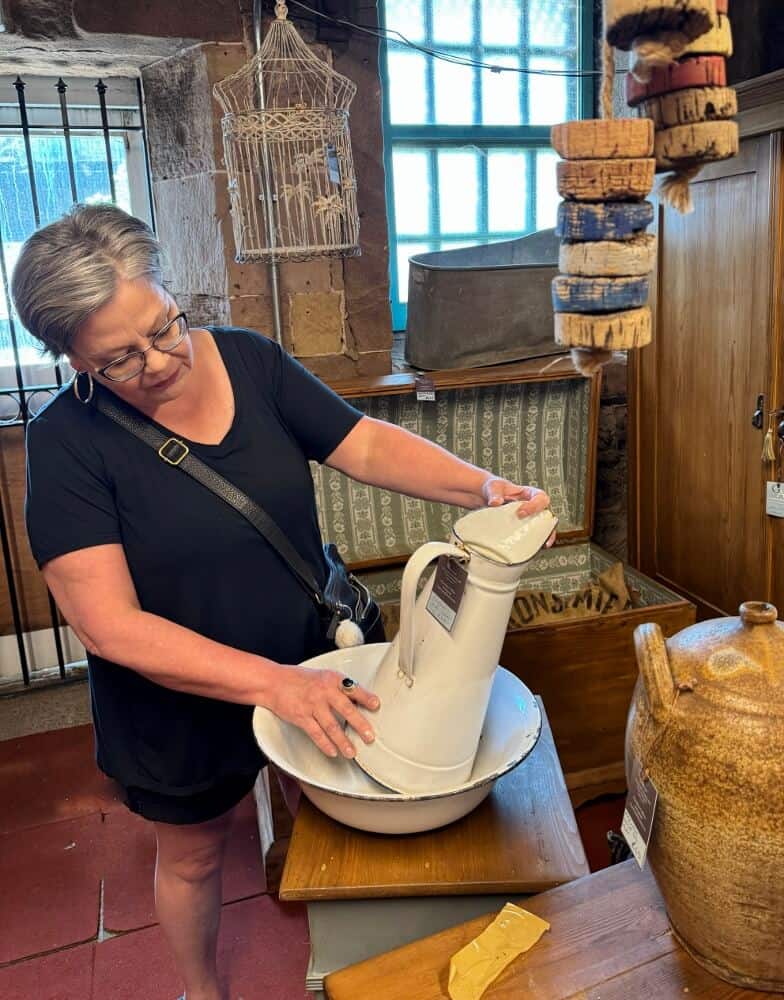 Diana examining a bowl and pitcher