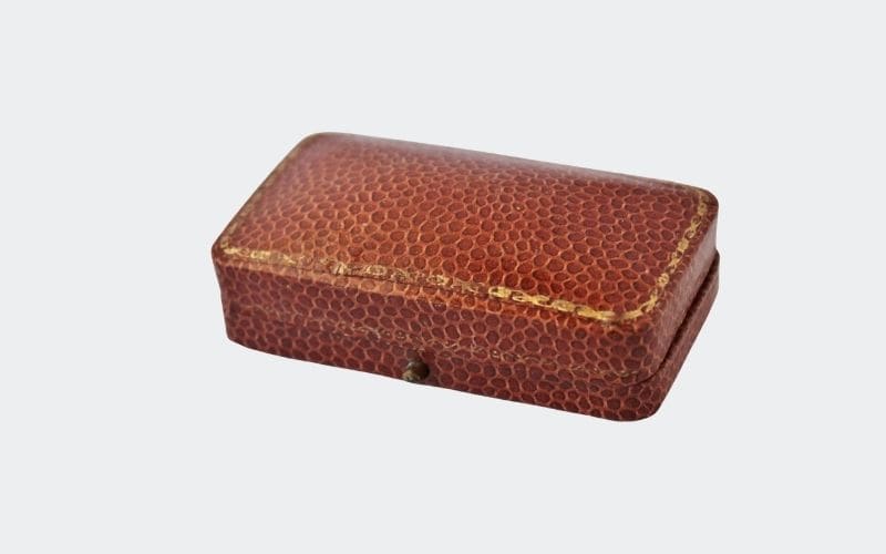 brown leather presentation box with gold decoration