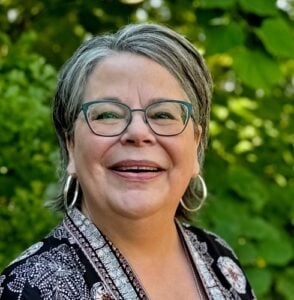 Head shot with trees in background