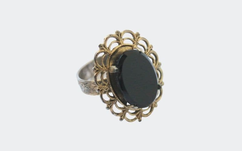 black cocktail ring with gold filigree