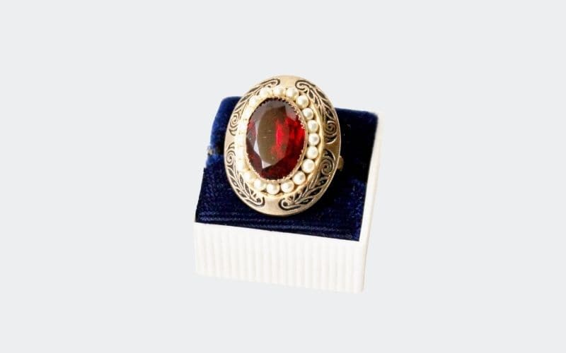 Red stoned cocktail ring surrounded by pearls