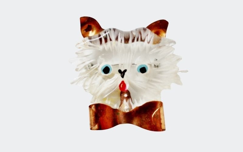 clear cat pin with copper ears and bow
