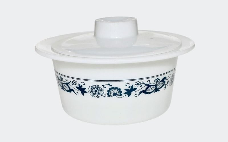 white covered dish with dark blue decoration around  the lip