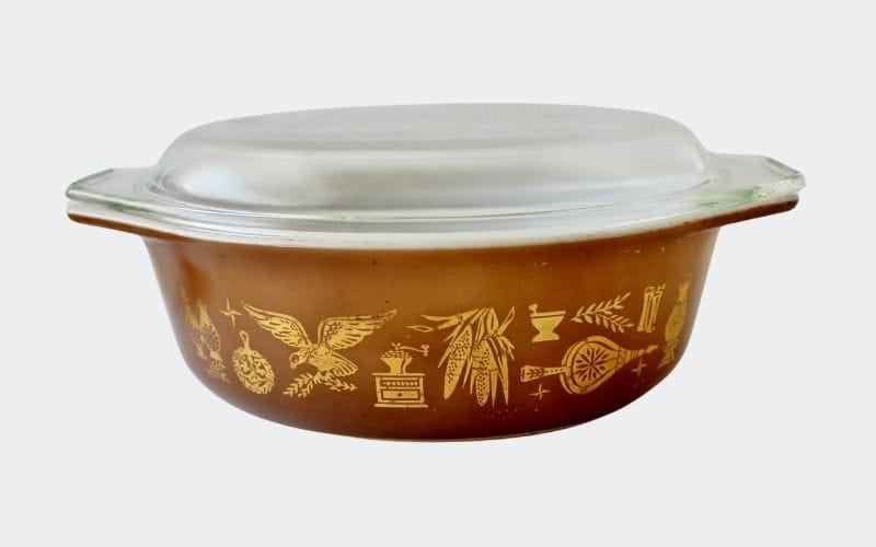 brown oval casserole with gold decoration