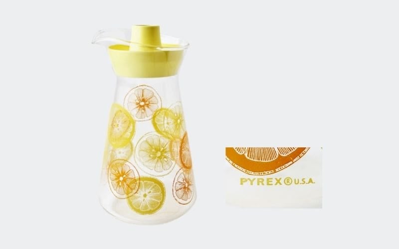 clear juice jugs with lemon and orange slice decoration