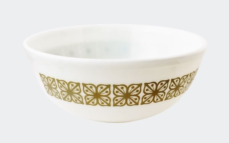 large white mixing bowl with olive green floral decoration around rim