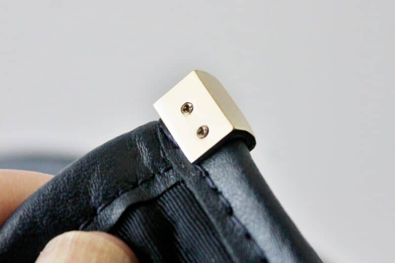 gold metal accent on corner of kate spade bag