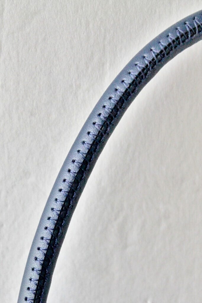 blue leather handle with stitching