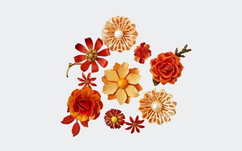Collection of pretty, orange shaded floral pins