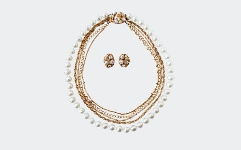 pearl and gold wedding type necklace with matching earrings