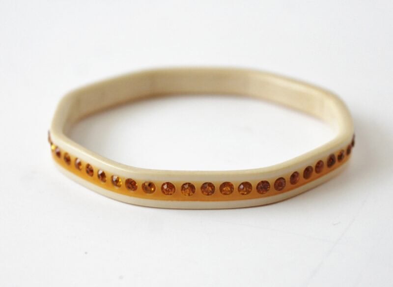Ivory bangle bracelet with yellow rhinestones