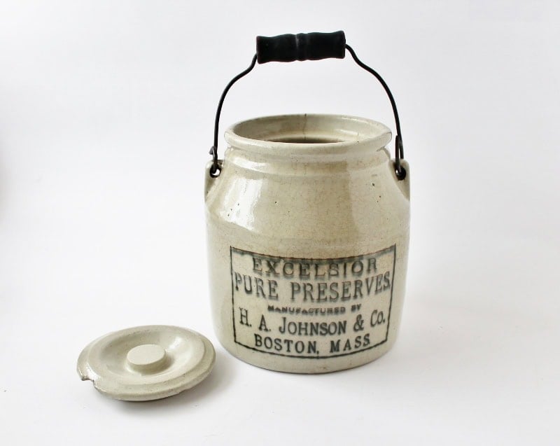 Antique ceramic jar for preserves with lid and handle, vintage kitchen decor.