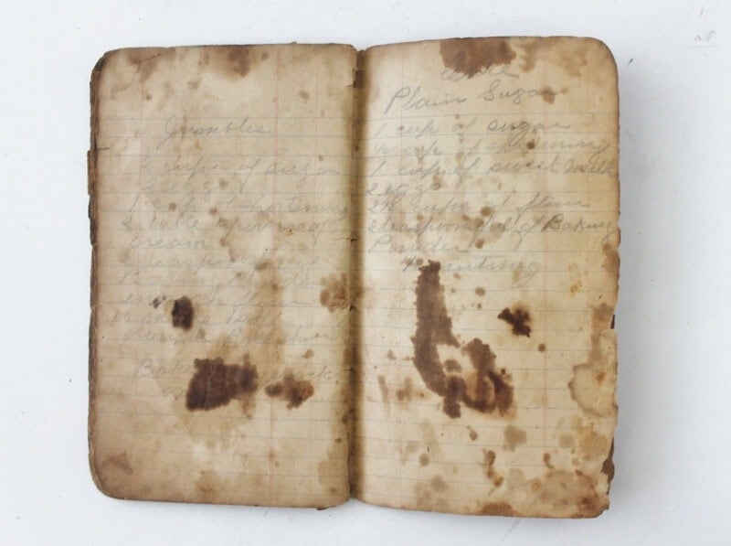 antique recipe journal opened up to aged pages