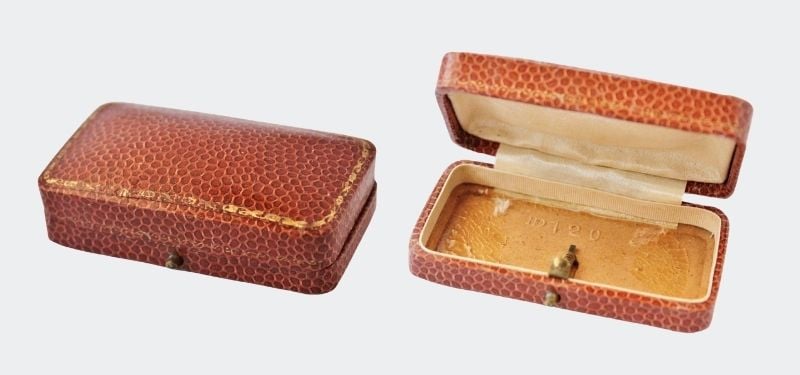 outside and inside of brown leather box