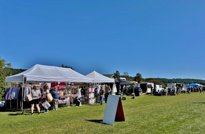 large flea market on a cloudless, blue-sky day
