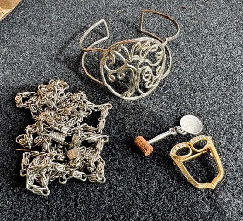 4 pieces of jewelry: necklace, bracelet, charm, and pin